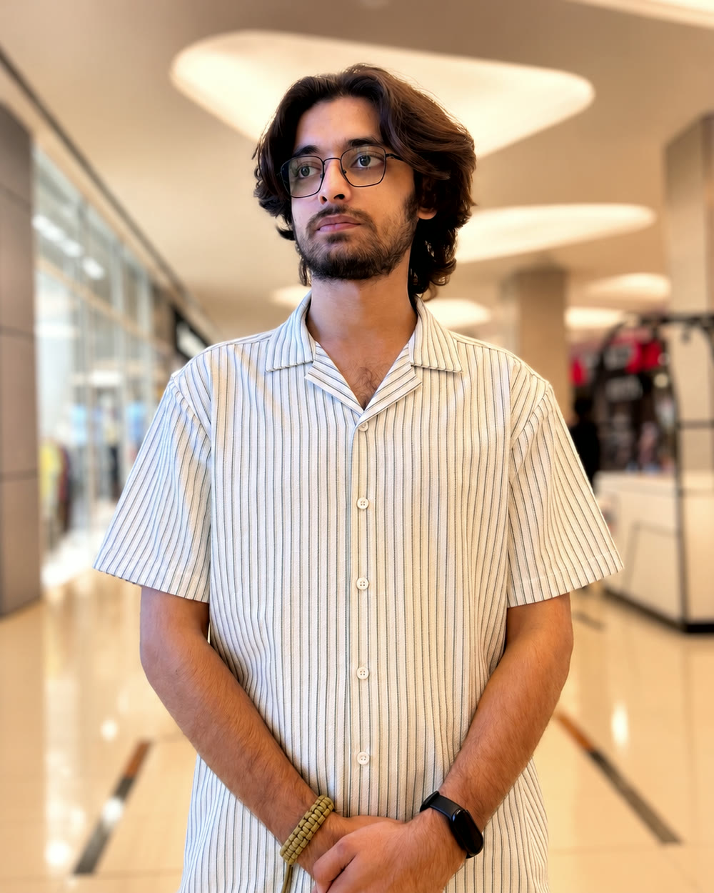 Taqi Saeed, web developer, in a striped shirt
